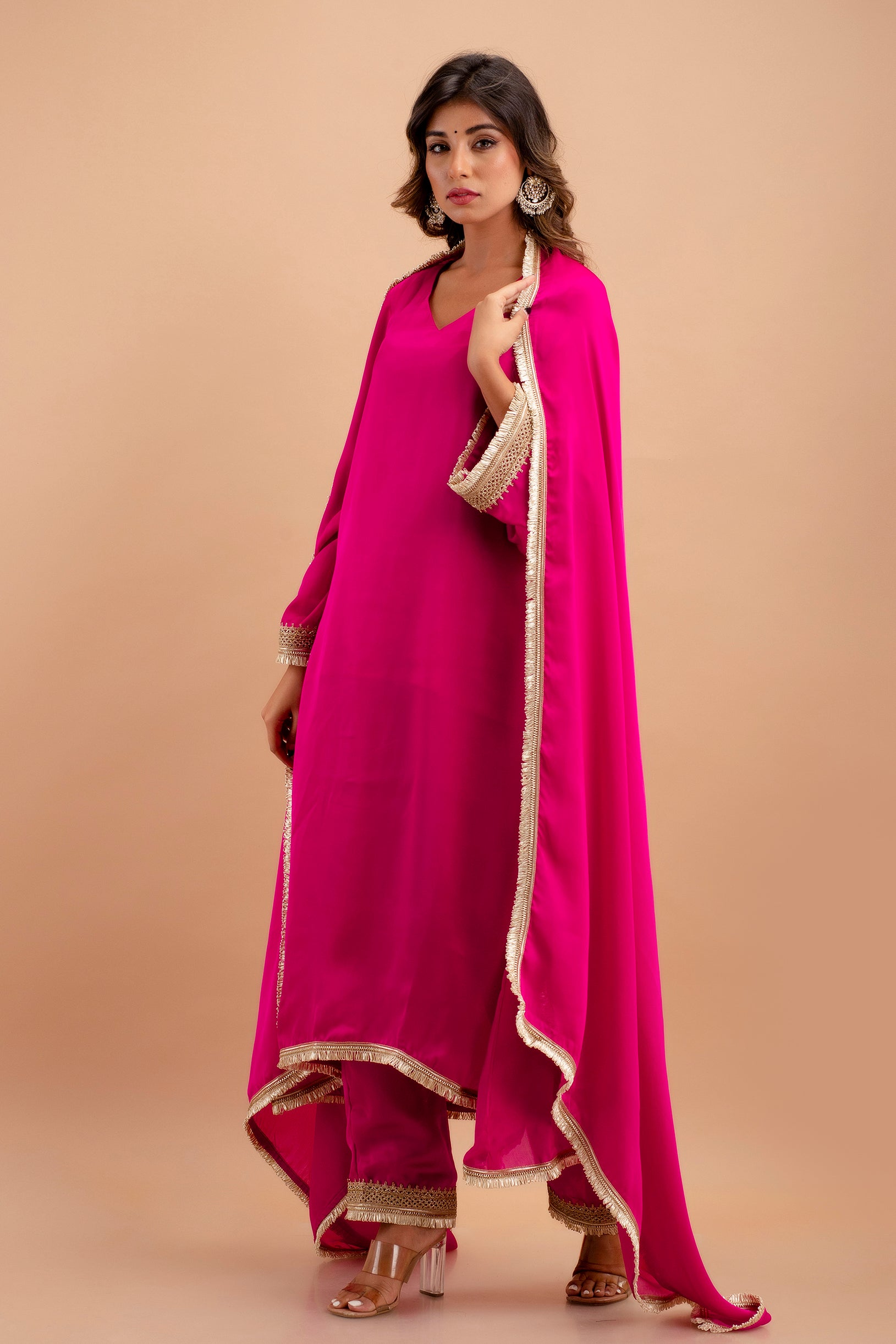 Adorned with Intricate Lace Embellishments, the Ensemble Features a Kurta, Pants, and Dupatta