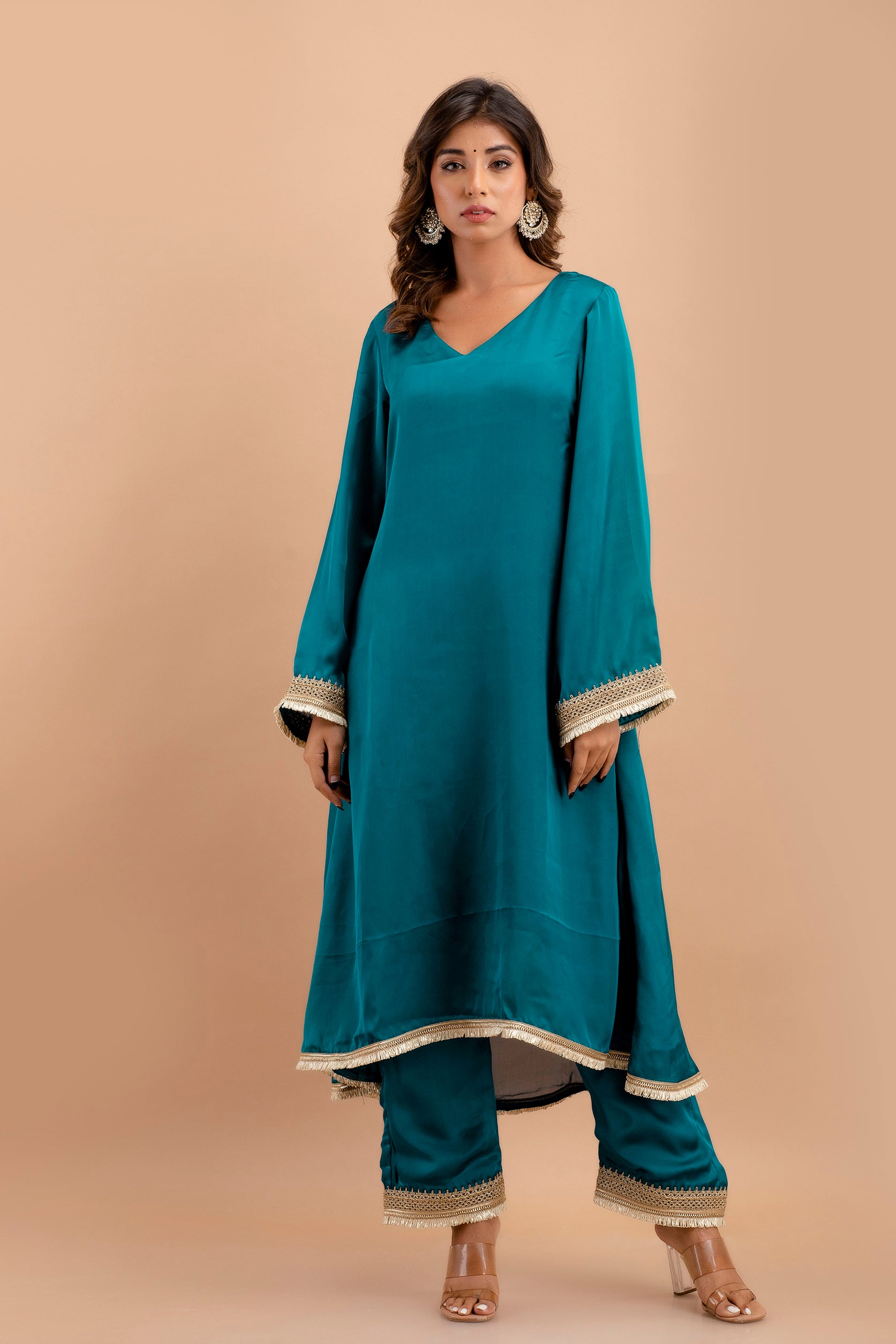 Adorned with Intricate Lace Embellishments, the Ensemble Features a Kurta, Pants, and Dupatta